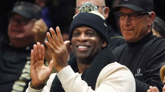 Colorado football coach Deion Sanders attends a men’s basketball game.
